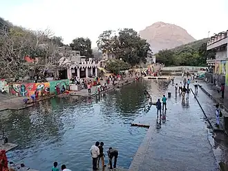 Damodar Kund with a view of the Girnar Hills in the background.