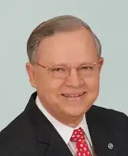 Head shot of Busby smiling