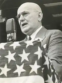 1939 black and white photo of Buffalo, New York postmaster standing at a podium while giving a speech