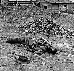 Confederate artilleryman killed during the final Union assault against the trenches at Petersburg. Photo by Thomas C. Roche, April 3, 1865.[304][305] Although prints of this picture list it as being taken at Ft Mahone, historians at the "Petersburg Project" believe it was taken at Confederate Battery 25[306]