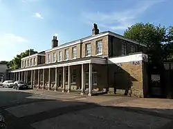The Colonnade (houses and offices) by the main gate.