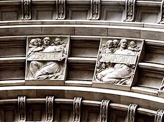 Detail of two of Alfred Drury's relief panels above the main portal. The full inscription is taken from Joshua Reynolds's Discourses: "The excellence of every art must consist in the complete accomplishment of its purpose".