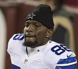 Bryan wearing his uniform and a Cowboys beanie cap