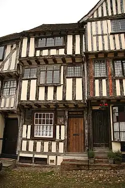 15th century timber-framed houses with overhanging jetties in Thaxted, England.
