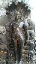 Tirthankara Parshvanatha of Jainism standing under Nāga hood