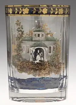 Novelty Russian tumbler; the glass has two layers, and the gap has the landscape image built up with moss, straw, paper, sand, stone, clay and mica, as well as painted enamel, 1800–10