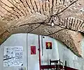 Former café space, with the preserved barrel vault visible in the room