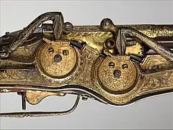 Close-up image of the weapon's rotating wheels.