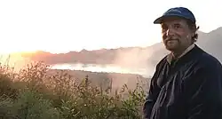 Douglas Stevenson at the summit of a volcano in Bali, Indonesia in 2016