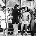 Farrell conducting a "men's beauty contest" on the Mike Douglas Show with Alan Alda, Billy Davis Jr., and Marilyn McCoo, about 1976
