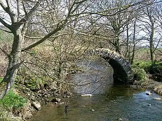 The ancient and ruined Drumachloy Bridge over the Drumachloy Burn