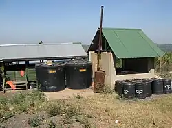 Drums with septic tank sludge with different amounts of urea added (6881892839)