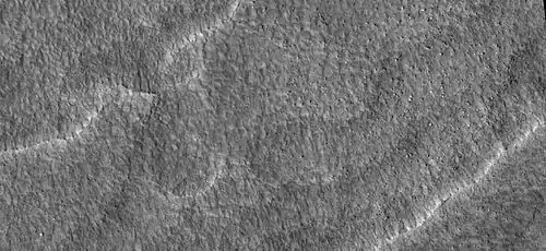 Close-up of scalloped ground, as seen by HiRISE under HiWish program. Surface is divided into polygons; these forms are common where ground freezes and thaws. Note: this is an enlargement of a previous image.