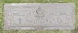 Bronze plaque inscribed with the name Dawson, and smaller name plates for Earl P. and Madeline
