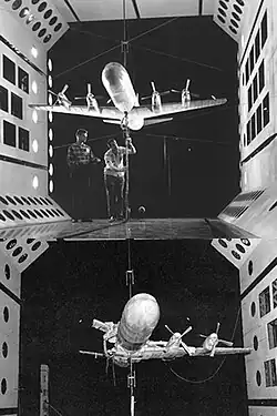 A model of an aircraft in a wind tunnel