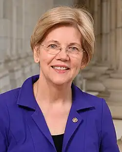 Woman in a blue coat and spectacles