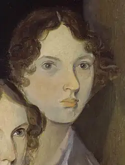 A portrait of a young woman with curly brown hair and a pale, expressionless face.