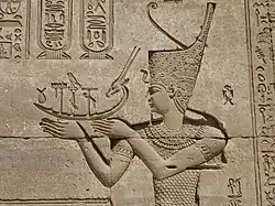 Emperor Trajan as a Pharaoh making an offering to the Gods, in Dendera.[21]