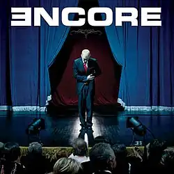 The cover features Eminem onstage, bowing before an audience. Above the image is the album title.