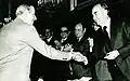 National Prize for Arts and Sciences (Mexico) shaking hands with José López Portillo, Mexico City.