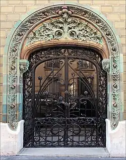 French Art Nouveau – Entrance decorated with glazed tiles of the Les Chardons Building (Rue Eugène-Manuel no. 2), Paris, 1903, by Charles Klein[66]