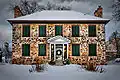 Exterior view of Ermatinger House in winter