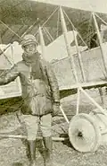 Bullard beside a Caudron trainer