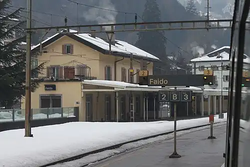 Three-story building with gabled roof