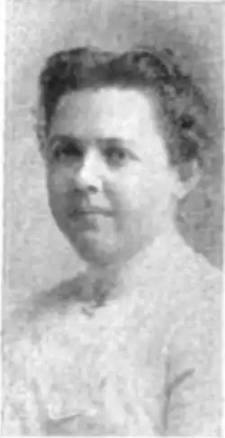 B&W portrait photo of a woman with her hair in an up-do