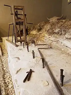 Line of feathers and wedges ready to split a post off