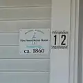 The identifying sign on the face of the Amos Keyes House
