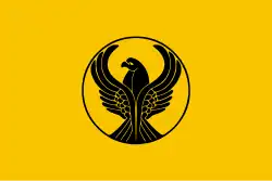 Yellow flag with a stylized black eagle in the center. The eagle's wings are spread.