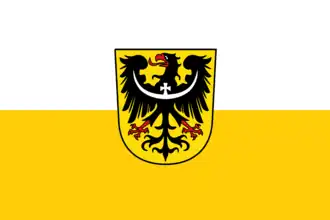 The variant version of the flag of Lower Silesia, used in Saxony, including the coat of arms of Lower Silesia.