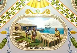 Representing the Great Banks and North Atlantic fisheries, this vignette depicts salt bins, a rod shed, and a pier; a three-masted ship is seen offshore.