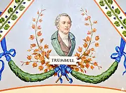 A painting depicting a portrait of John Trumbull. He is wearing a green unbuttoned suit, and is looking to the right. Under him are green garlands and plants, and directly under him is the text "TRUMBULL".