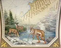 A member of a hunting-gathering tribe is shown in a northern forest with pine and fur trees.