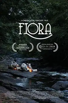 Four people sitting huddled around a fire on a smooth black stone beside a creek running through a dark forest. The title says "FLORA". It is noted to be an "Official Selection" of Sci-Fi-London and a "Winner" at the Amsterdam Film Festival.