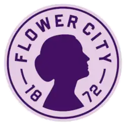 A silhouette of a woman's profile printed on a circular crest