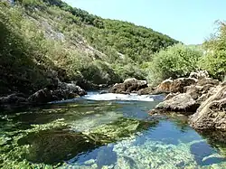 Unac leaving a canyon at Martin Brod outskirts.
