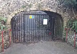 Archway connecting Forbury Gardens to Reading Abbey ruins, including retaining walls flanking path to Abbey ruins