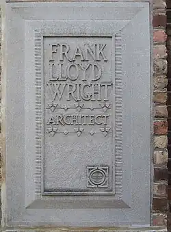 Limestone plaque on the studio's facade. The plaque bears the words "Frank Lloyd Wright Architect".
