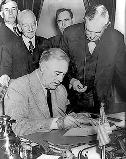 Roosevelt signing the declaration of war against Germany on December 11, 1941