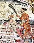 Fresco artwork of Guru Hargobind (seated).