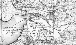 It is believed that the actual touchdown point lies near the centre of Stultz's signature, as Friendship arrived in the Burry Estuary at low tide. At that time, the only navigable water would have been the channel of the Loughor River,[1] shown on the map beneath Stultz's name. The landing spot co-ordinates are roughly 51°40′34.9″N 4°13′03.0″W / 51.676361°N 4.217500°W. The map was signed while the crew rested at the Fricker's metal works offices in Burry Port.