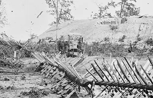 Confederate Army fortification around Atlanta with photographers' buggy in the background, 1864