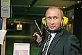 Vladimir Putin uses a shooting range inside the GRU headquarters during a 2006 visit