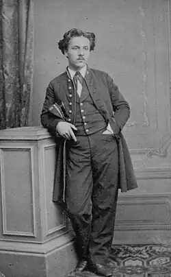 young man in 19th-century college uniform