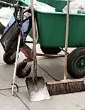 Street sweeper's tools: A paper clip, a shovel, a brush and the cart