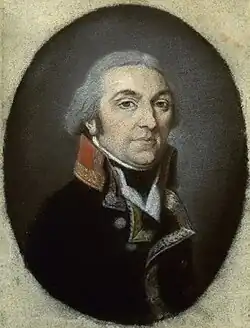 Color oval portrait of a gray-haired man in a dark blue military coat with a red collar