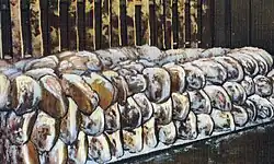 Postcard image of hams in the dry salt process